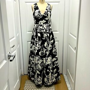 Sleeveless tucked skirt gown.